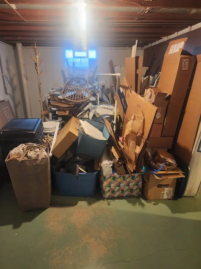 Roll-off dumpster container at job site for 2 Yard Dumpster Rental in Croghan