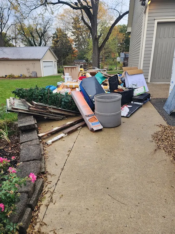 Dumpster being loaded with debris for 30 Yard Dumpster Rental in Croghan